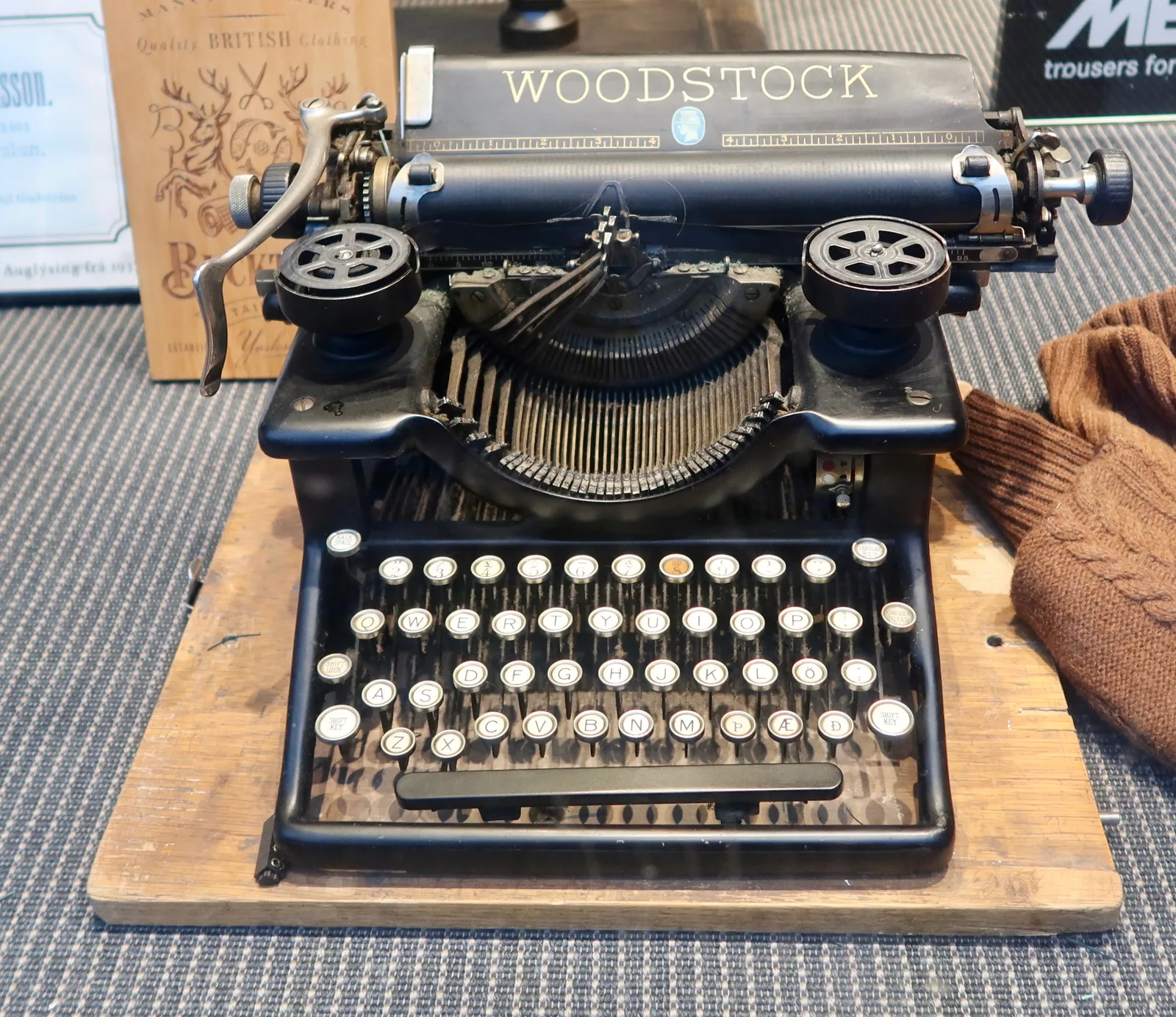 Antique black Woodstock typewriter on a wooden base on a tabletop